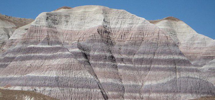 Bentonite Clay A mountain with many layers of rock on it